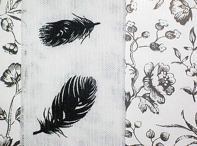 white and black floral textile thumbnail