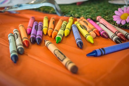 assorted Crayolas on brown wooden table thumbnail