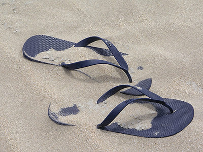 pair of black slippers thumbnail