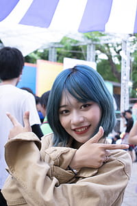 Blue-haired Woman Wearing Brown Long-sleeved Top thumbnail