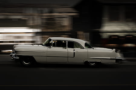 classic white convertible sedan in time lapse photograph thumbnail