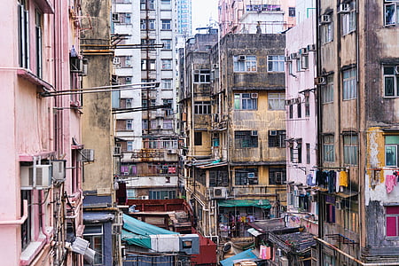 selective photography of concrete houses at daytime thumbnail