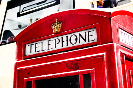 red Telephone station in close-up photography at daytime thumbnail