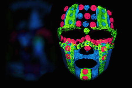 person with green, blue, and red face paint thumbnail