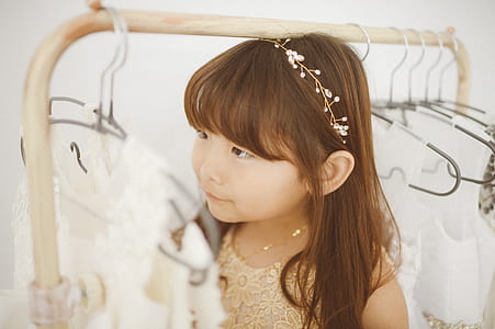 girl wearing beige lace sleeveless top thumbnail