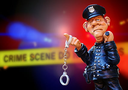 police holding handcuff figurine thumbnail