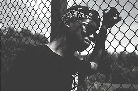 greyscale photo of man wearing sunglasses thumbnail