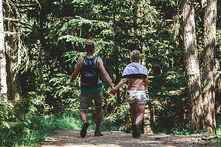Man and Woman Walking in Forest thumbnail