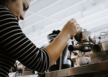 woman holding coffeemaker thumbnail