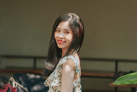 Woman in White Floral Top thumbnail
