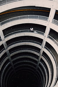 man standing near grey steel handrail thumbnail
