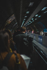 selective focus photography of man on escalator thumbnail