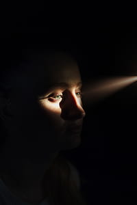 womans face close-up photography thumbnail