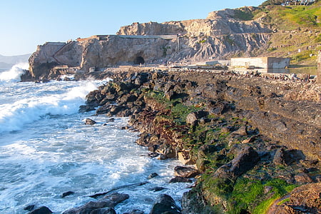 aerial photography of sea near mountain range thumbnail
