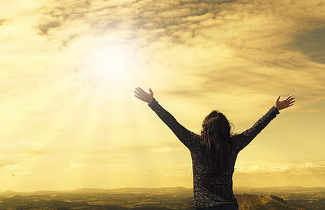 woman wearing gray sweatshirt raising her hands thumbnail