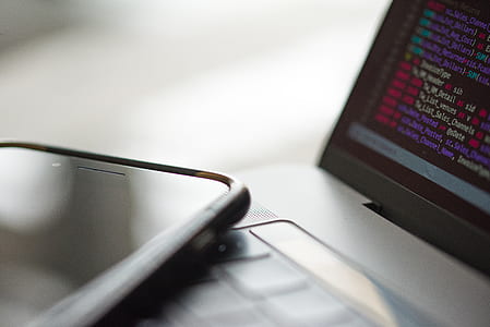 black smartphone on laptop thumbnail