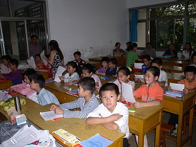 group of children sitting on writing desk thumbnail