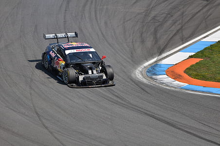 black stock car on road thumbnail