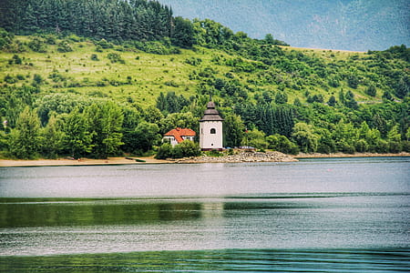 White House Near Mountain and River thumbnail