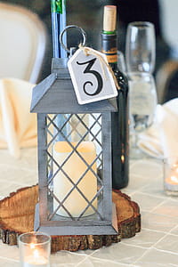 Selective Focus Photography of Candle Lantern on Table thumbnail