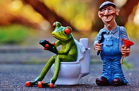 frog and man figure on gray floor thumbnail