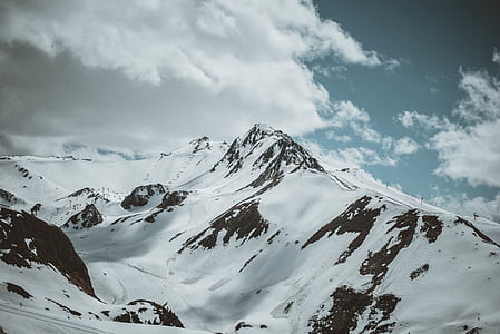 snow covered mountain during daytim thumbnail