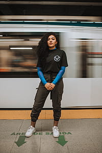 Woman Standing In Front Of Train thumbnail