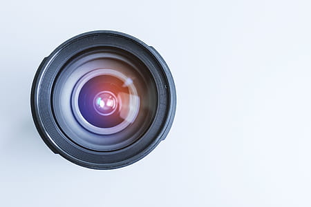 Modern lens on a photographer’s desk. Detail of the lens thumbnail