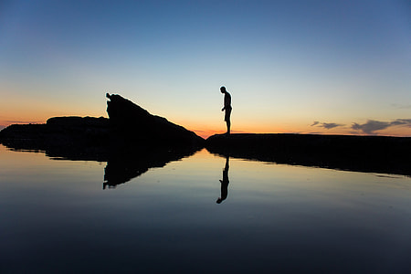 Man Standing on the shore at Laguna Beach, California thumbnail