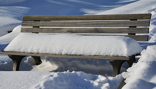 snow on brown wooden bench thumbnail