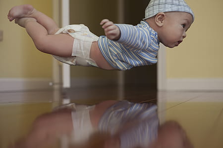 baby in white and blue striped sweater thumbnail