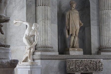 concrete statue of two men thumbnail