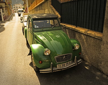 classic green Citroen car parks near concrete wall thumbnail