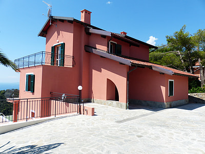 pink and black 3-storey house in front tree thumbnail