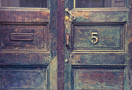 Old wooden entrance doors with metal door number sign and mail h thumbnail