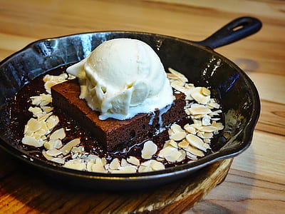 chocolate fudge with ice cream on black cast iron pan thumbnail