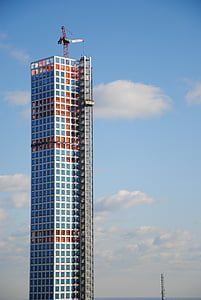 white tower crane on top of building thumbnail