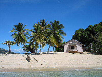white house on beachshore during daytime thumbnail