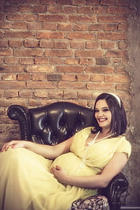 woman sitting on leather chair while smiling thumbnail