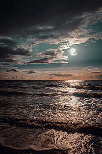 Seashore Under White and Blue Sky thumbnail