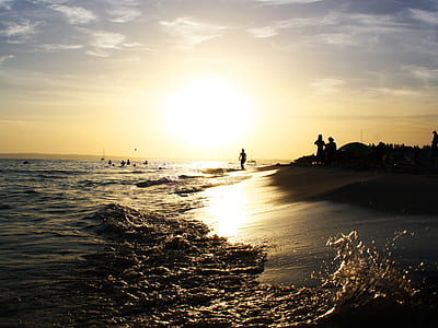 people standing near body of water thumbnail