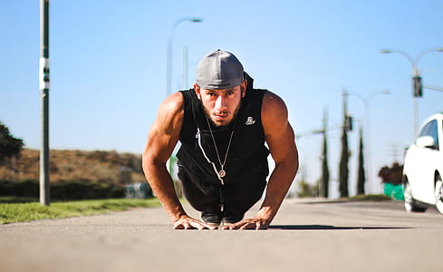man wearing black zip-up vest and gray cap thumbnail
