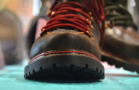 person showing brown leather boot thumbnail