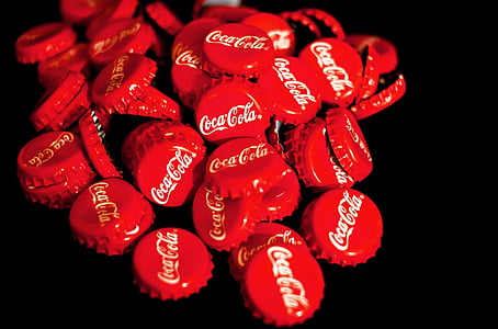 pile of red Coca-Cola bottle crowns thumbnail