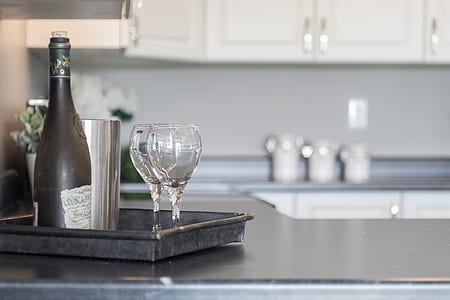 wine glasses and wine bottle on black tray thumbnail