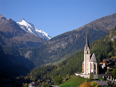 white and black church near mountain during daytime thumbnail