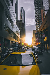 Photo of Cars on Asphalt Road Near Buildings thumbnail