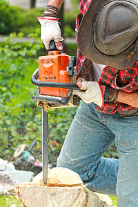 man cutting log with chainsaw thumbnail