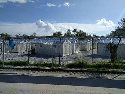 white houses near fence at daytime thumbnail