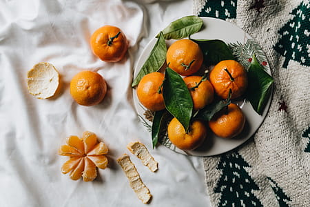 Still life of mandarin oranges with leaves thumbnail